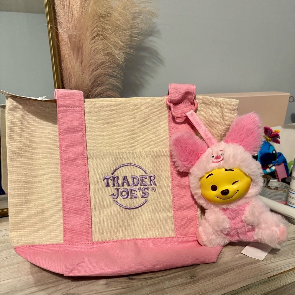 Trader Joe’s tote pastel pink with miniso Winnie the Pooh keychain
